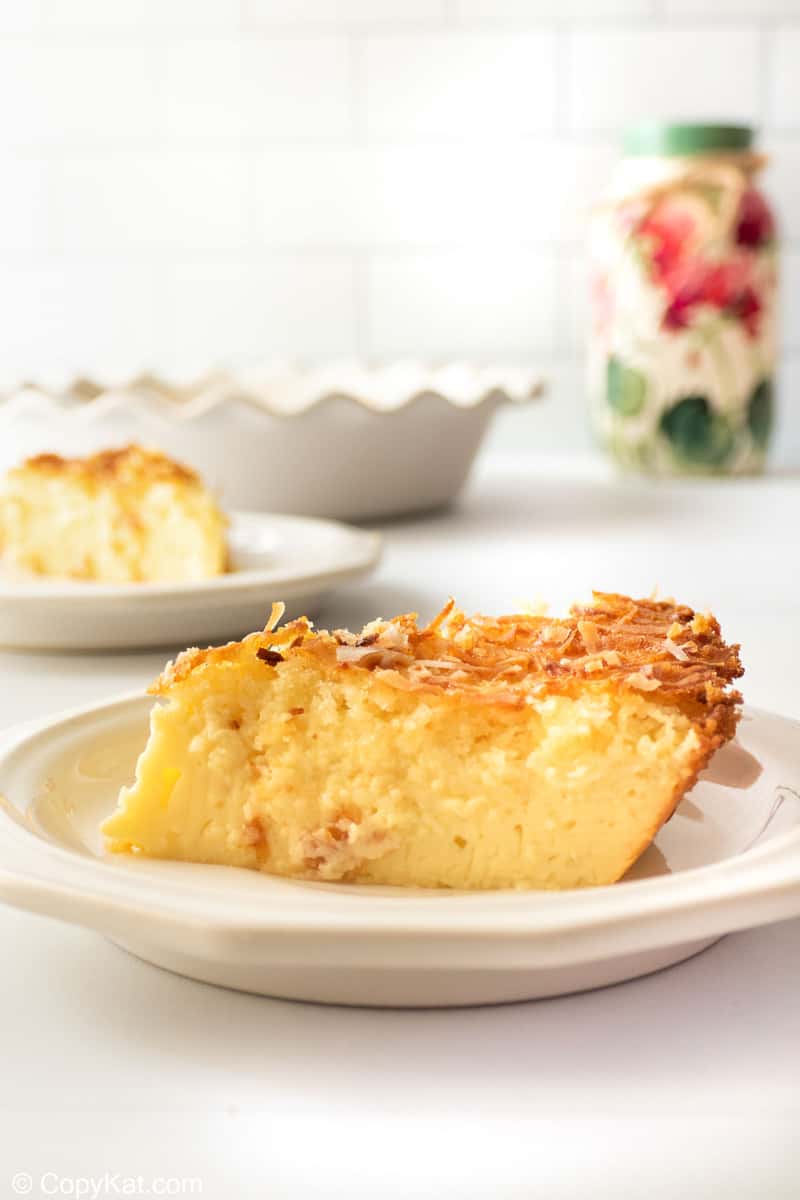 a slice of coconut custard pie on a plate