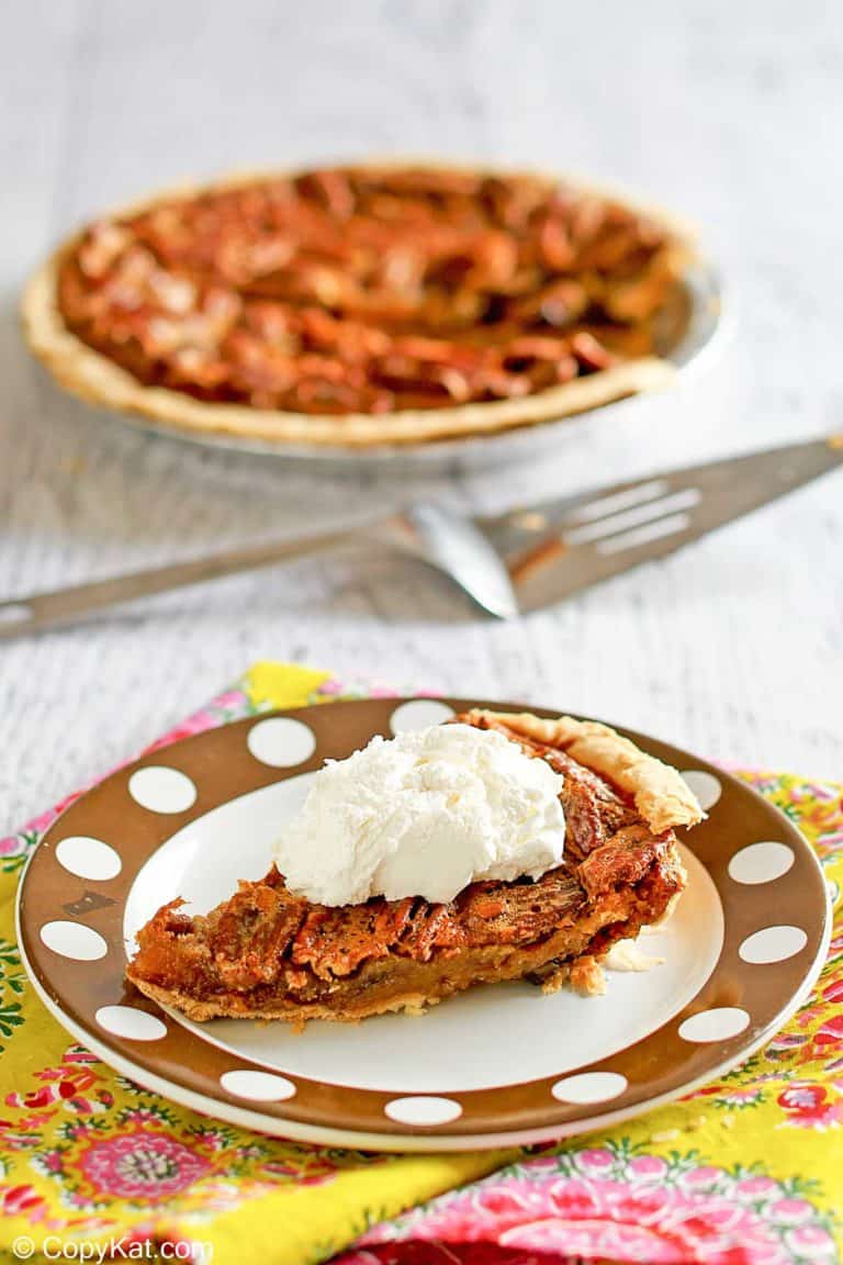 a slice of chocolate pecan pie on a plate