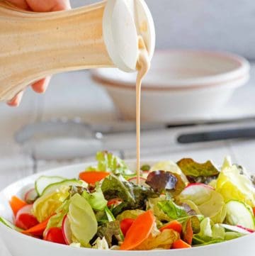 homemade Houston's Buttermilk Garlic Salad Dressing and a salad