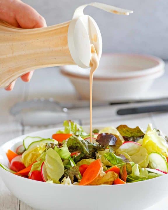 homemade Houston's Buttermilk Garlic Salad Dressing and a salad