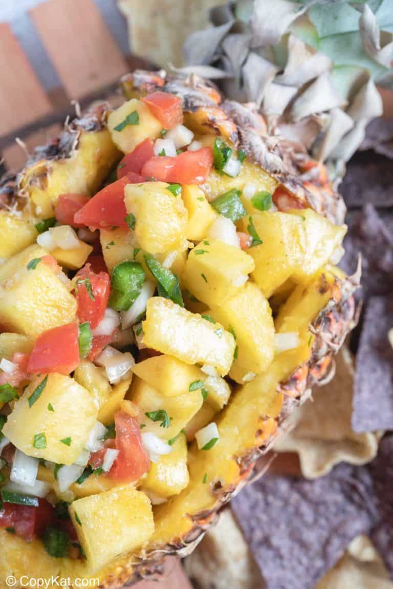 pineapple mango salsa in a fresh pineapple