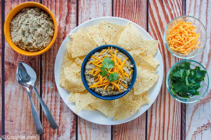 refried beans, tortilla chips, cheese, and cilantro