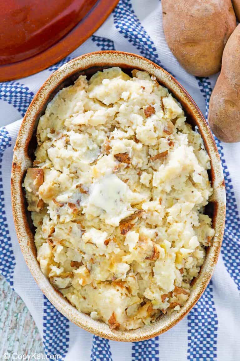 overhead view of roasted garlic mashed potatoes in a serving dish