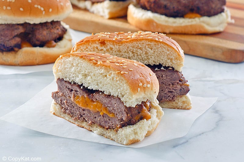 cheese stuffed burger on parchment paper