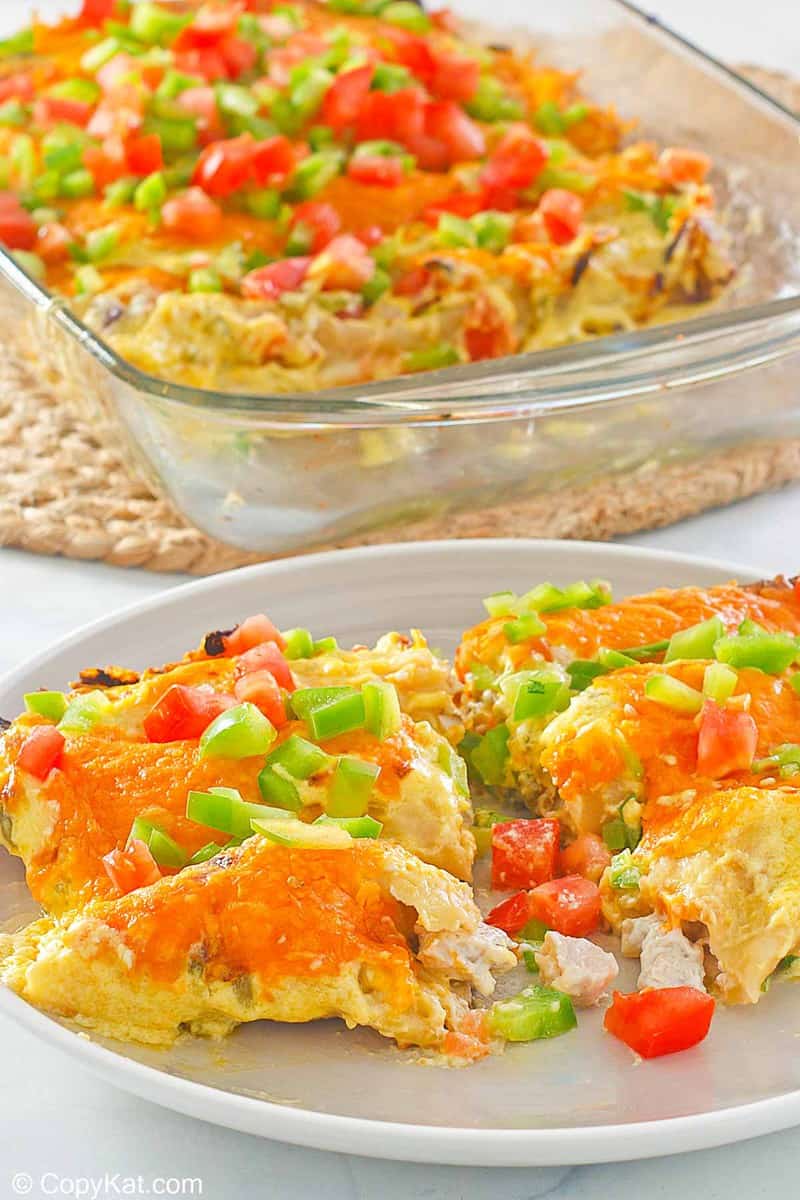 turkey enchiladas on a plate and in a glass baking dish