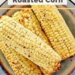a plate of roasted corn on the cob