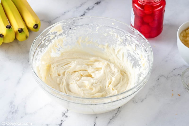 banana split cake cream cheese layer mixture in a bowl
