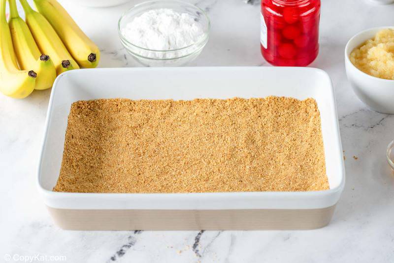 banana split cake crust in a cake pan