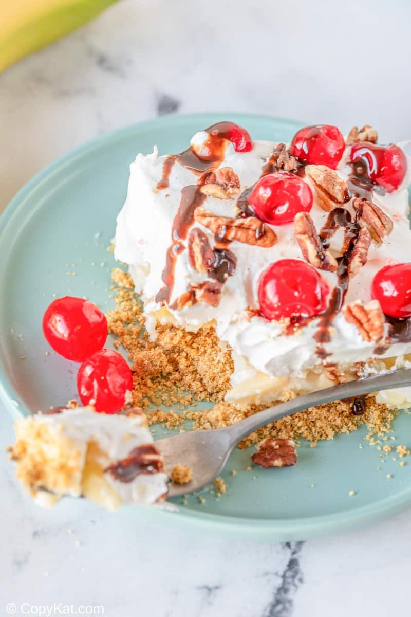 banana split cake and a fork on a plate