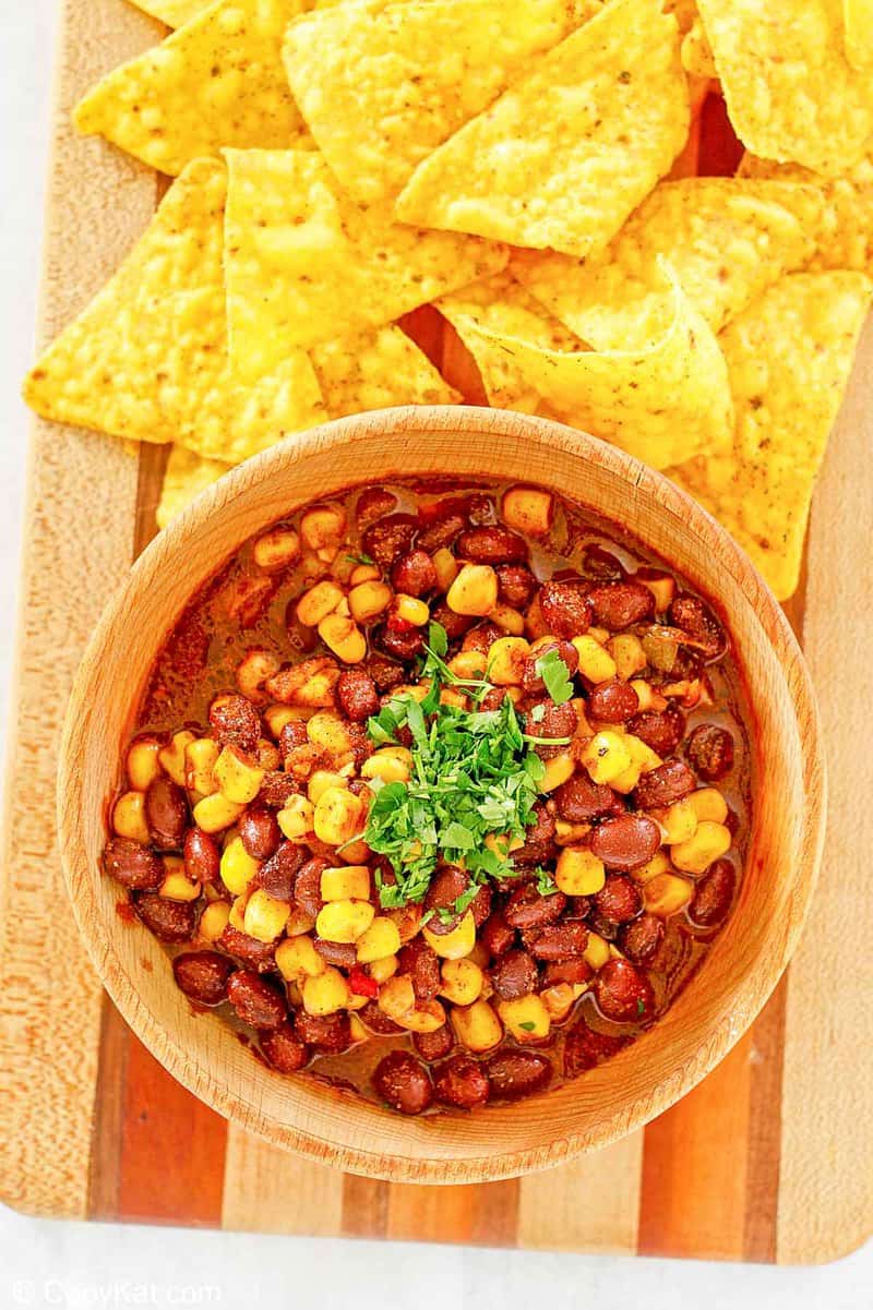 overhead view of black bean and corn salad and tortilla chips