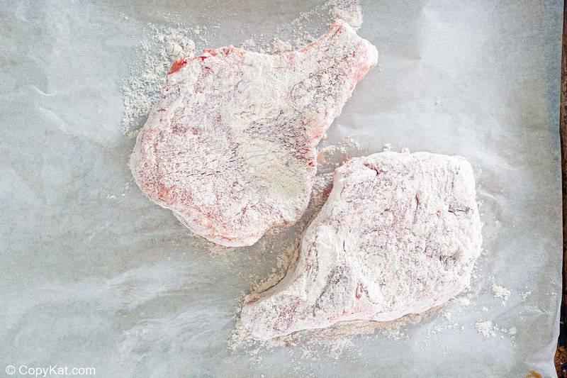 pork chops coated in seasoned flour breading