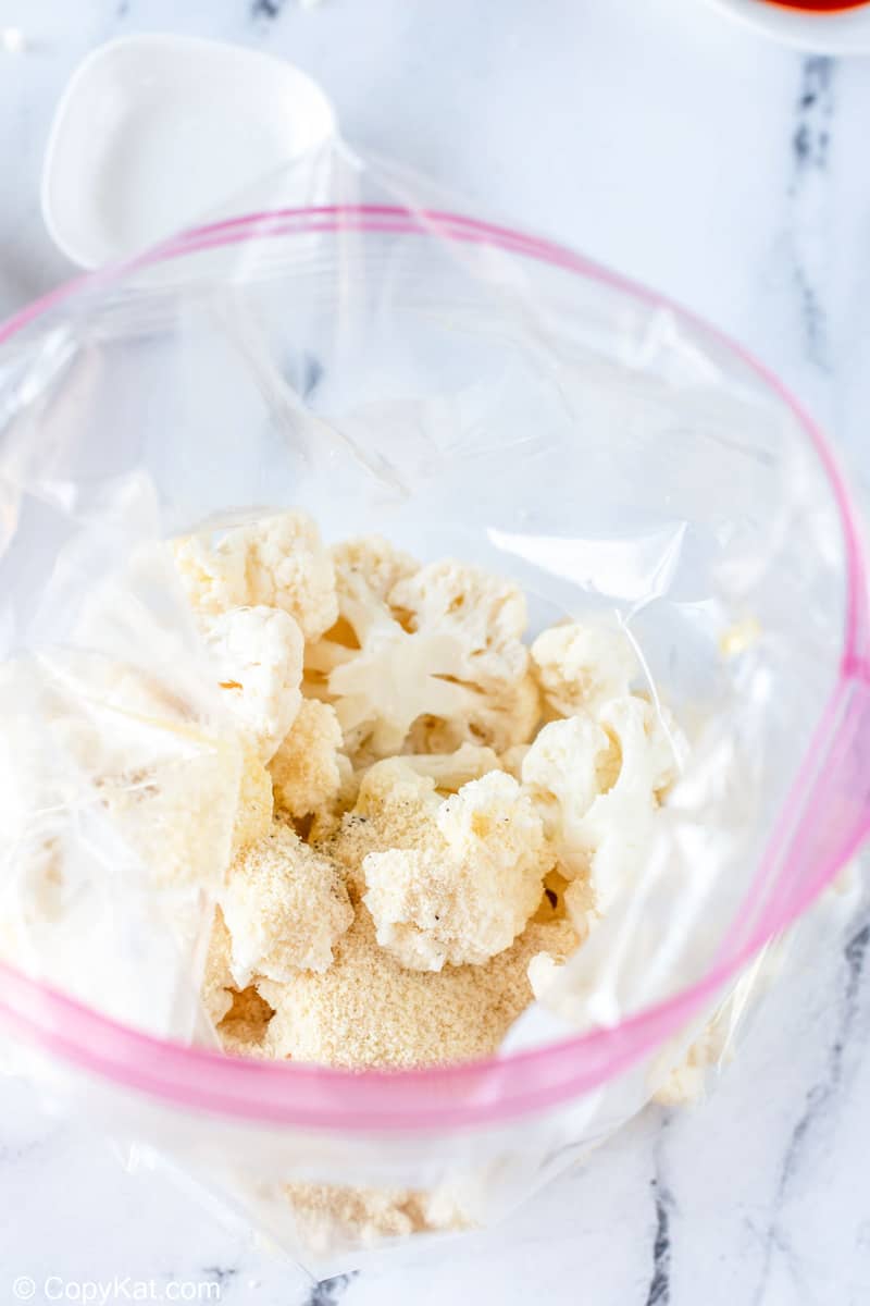 cauliflower, seasonings, and almond flour in a bag