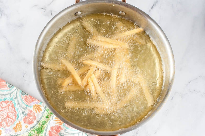 deep frying French fries in a pot