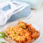 Dorito casserole on a plate and in a baking dish