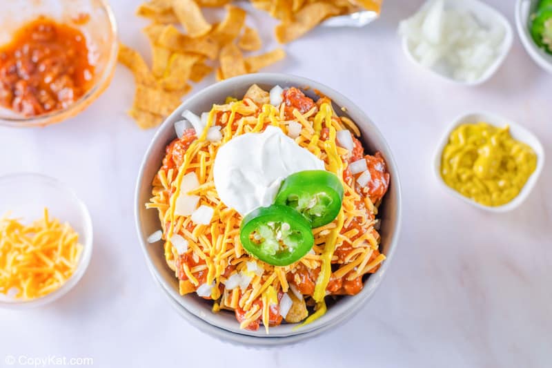 Frito pie and various toppings for it