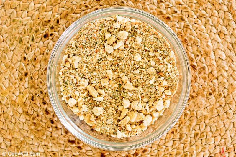 a bowl of homemade Italian bread crumbs on a braided mat