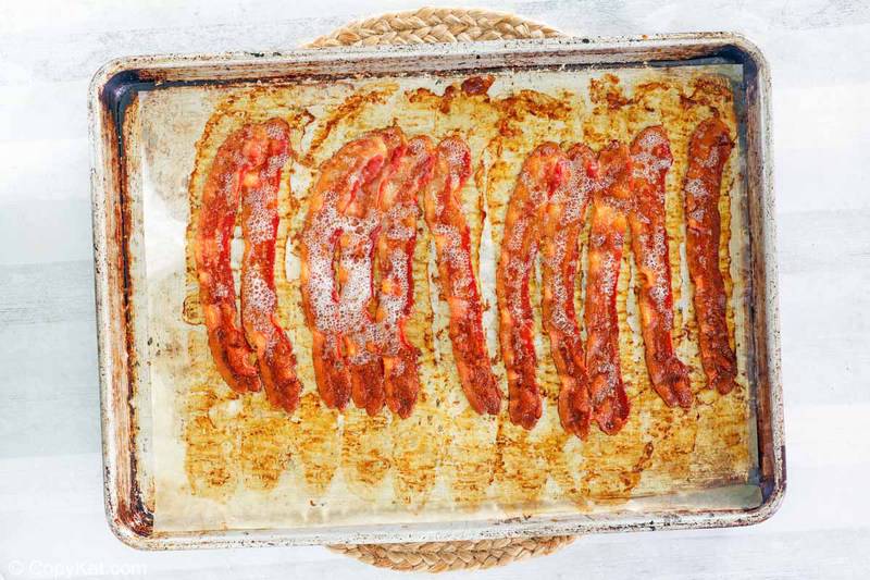 cooked bacon on a baking sheet
