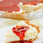 homemade Pappadeaux key lime pie with raspberry sauce on a plate and in a pie pan
