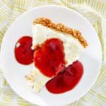 overhead view of a slice of homemade Pappadeaux key lime pie with raspberry sauce