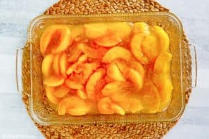 peach pie filling in a baking dish