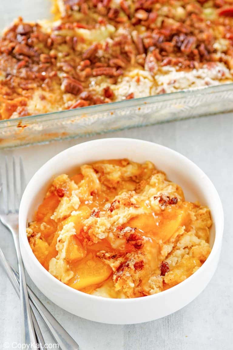 peach dump cake in a bowl and baking dish