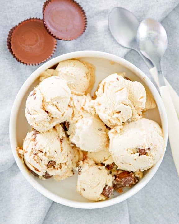 homemade peanut butter ice cream, peanut butter cups, and spoons
