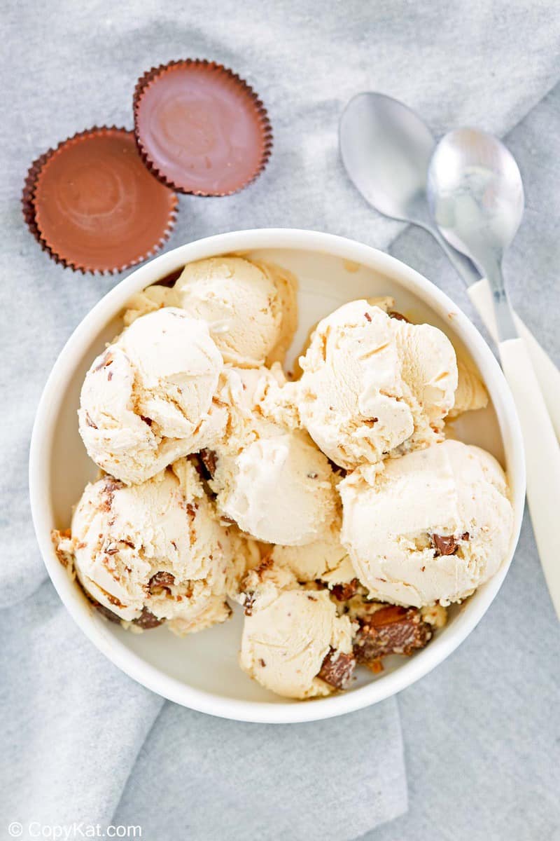 homemade peanut butter ice cream, peanut butter cups, and spoons