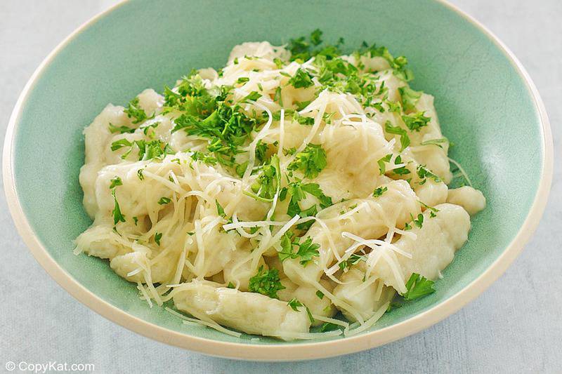 homemade gnocchi with parmesan and parsley in a bowl