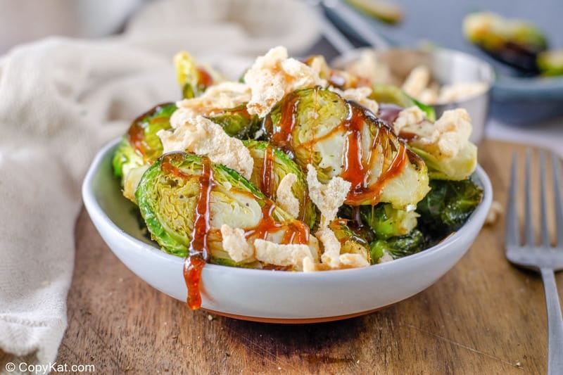 bowl of homemade Red Lobster crispy brussel sprouts with glaze and fried onions