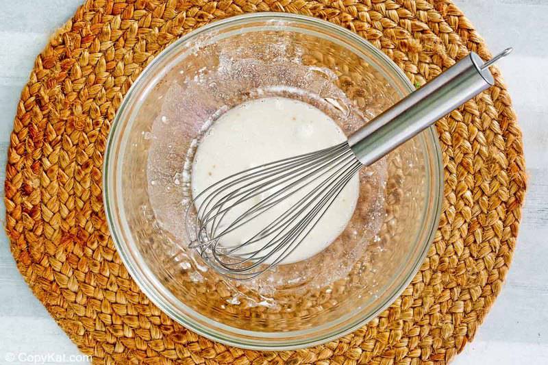 salmon juice and baking powder mixture in a bowl