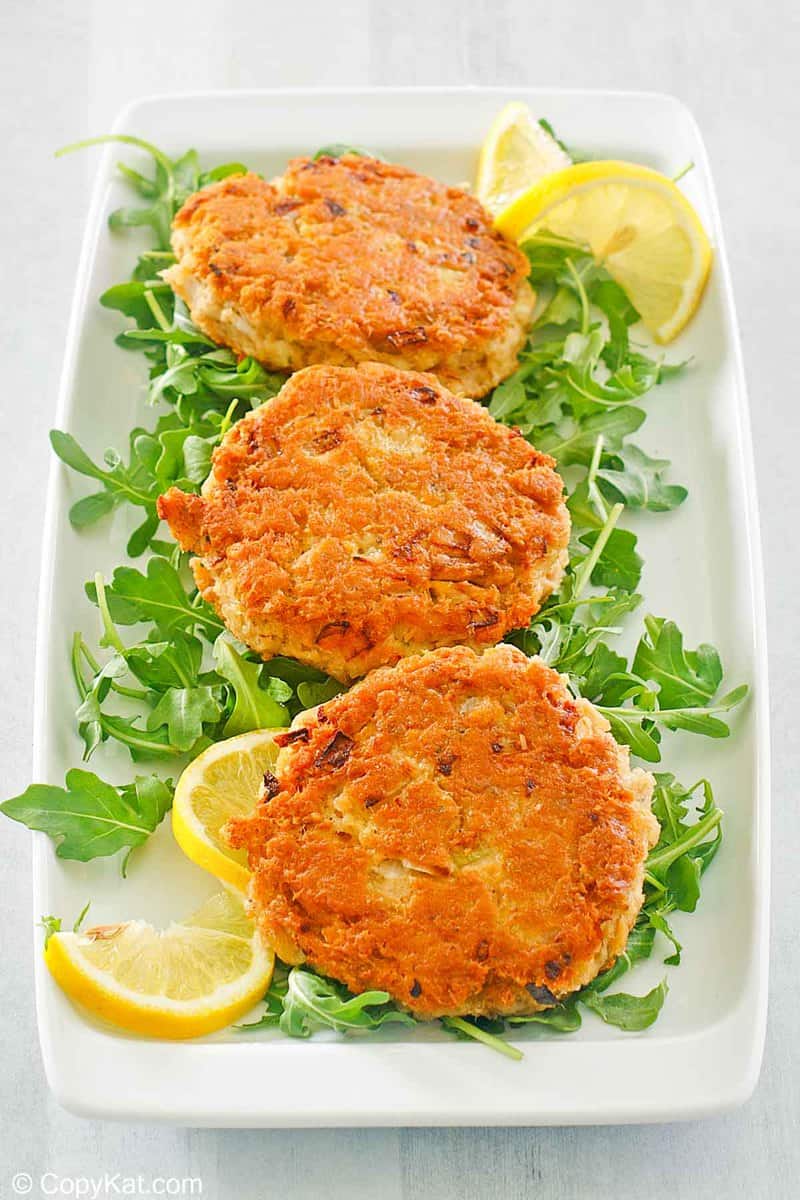 three salmon patties on a platter