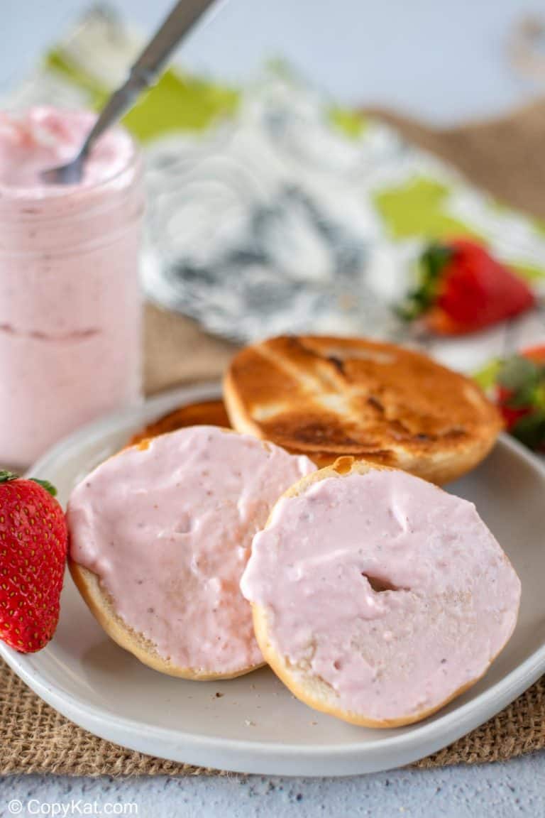strawberry cream cheese spread on a bagel