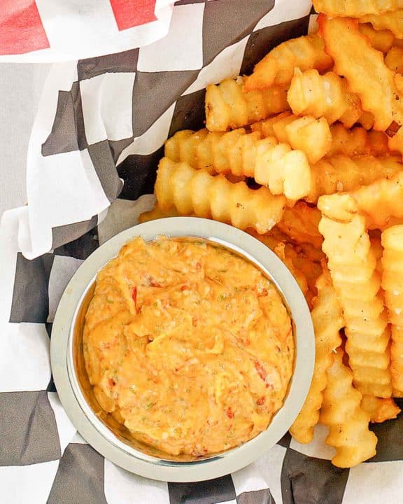 overhead view of a bowl of homemade Whataburger creamy pepper sauce and fries