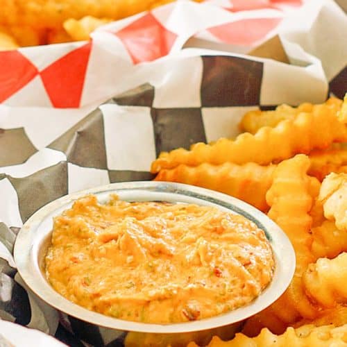 homemade Whataburger creamy pepper sauce in a bowl and French fries