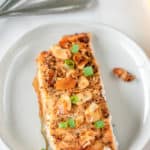 air fried salmon almondine on a white plate