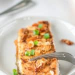 air fried salmon almondine and a fork on a plate