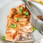 salmon almondine and a fork on a plate