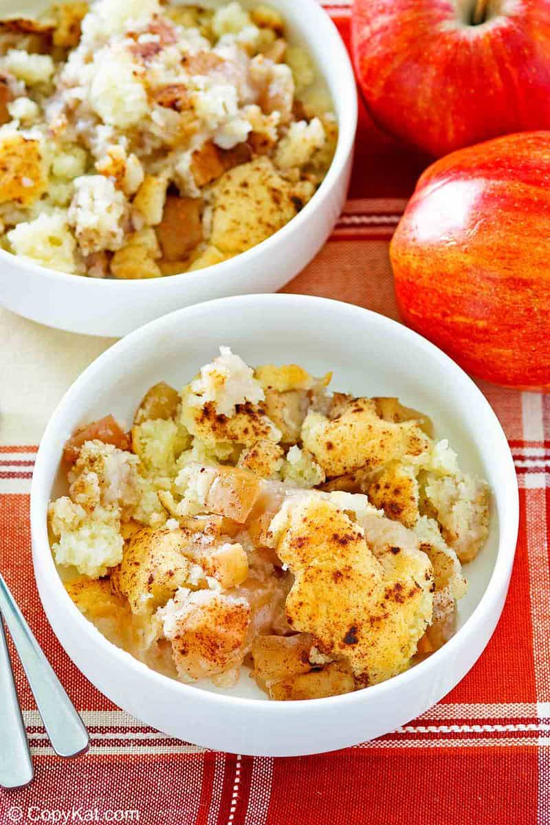 two apples and two bowls of Bisquick apple cobbler
