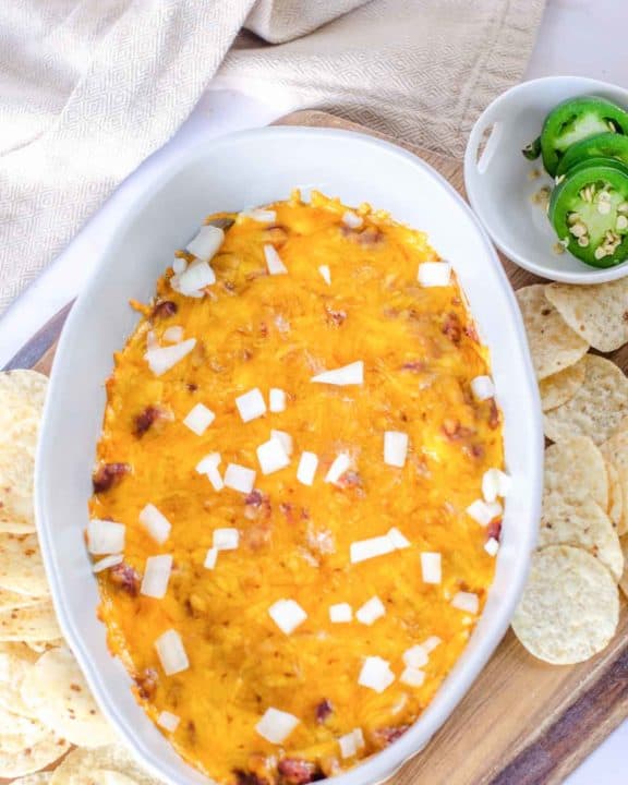 chili cheese dip, jalapeno pepper slices, and tortilla chips