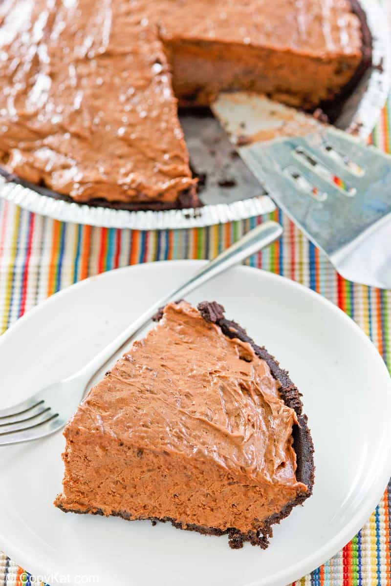 chocolate pudding pie in a pie plate and a slice on a plate