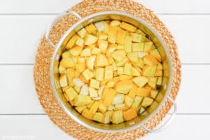 chopped yellow squash in a pan