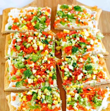 crescent roll veggie pizza on a cutting board