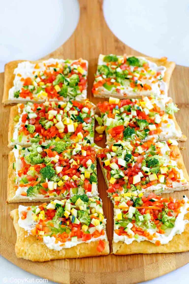 crescent roll veggie pizza on a cutting board