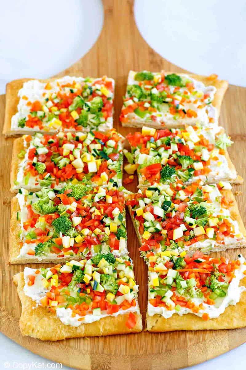 crescent roll veggie patch pizza on a cutting board