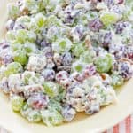 grape salad with cream cheese and walnuts on a platter