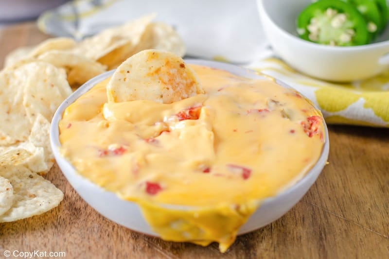 bowl of rotel dip beside tortilla chips