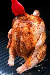 basting beer can chicken in a smoker