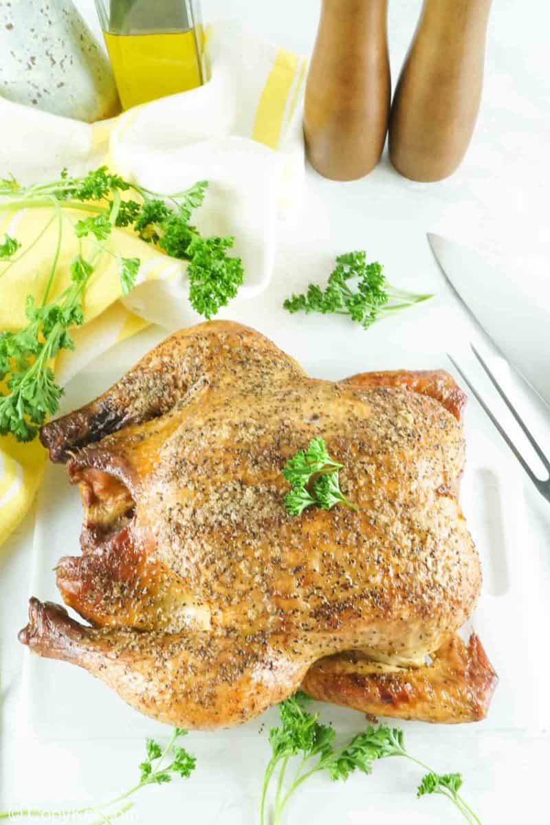 whole smoked chicken and fresh parsley