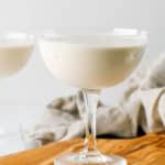 Brandy Alexander made with ice cream in a glass on a cutting board