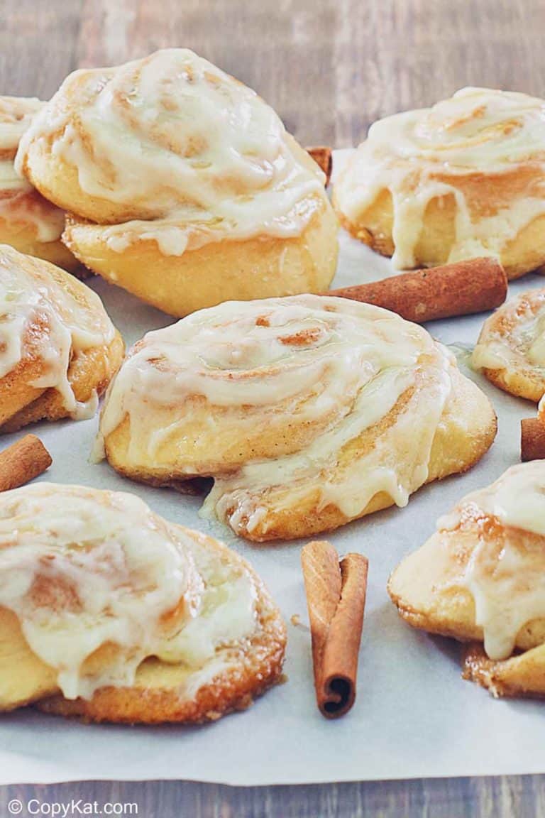 frosted cinnamon rolls and cinnamon sticks